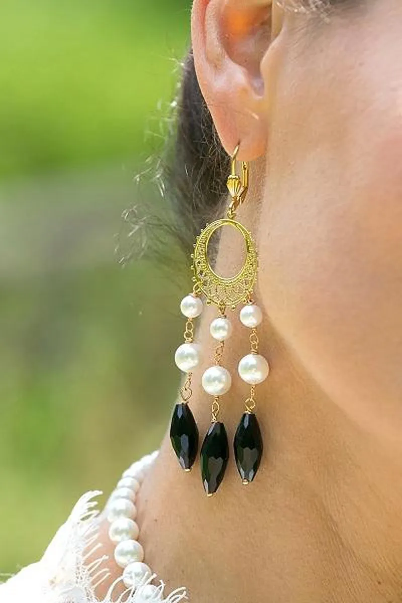 Statement white mother of pearl and black onyx gemstone earrings.